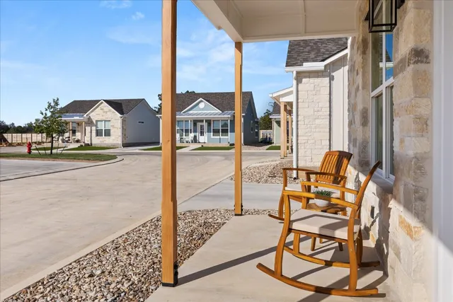 a view of a terrace with chairs and table