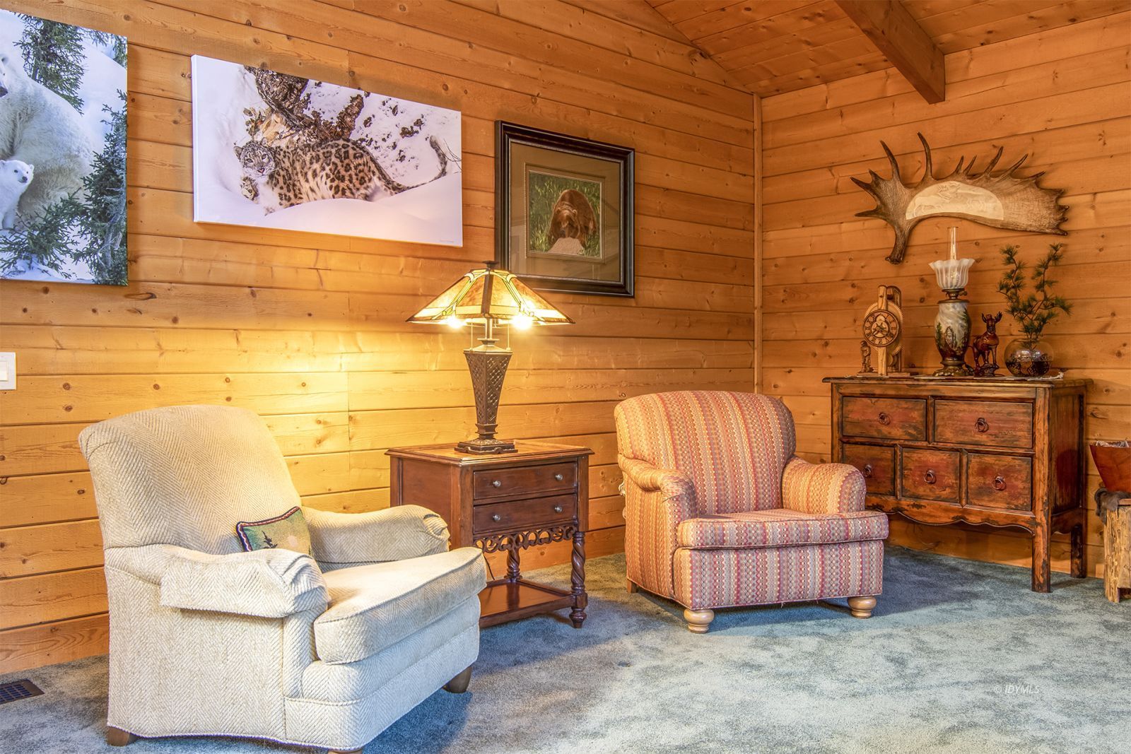 24924 Fern Valley Road Idyllwild, CA 92549 - Photo 23 of 44 a living room with furniture and a wall painting