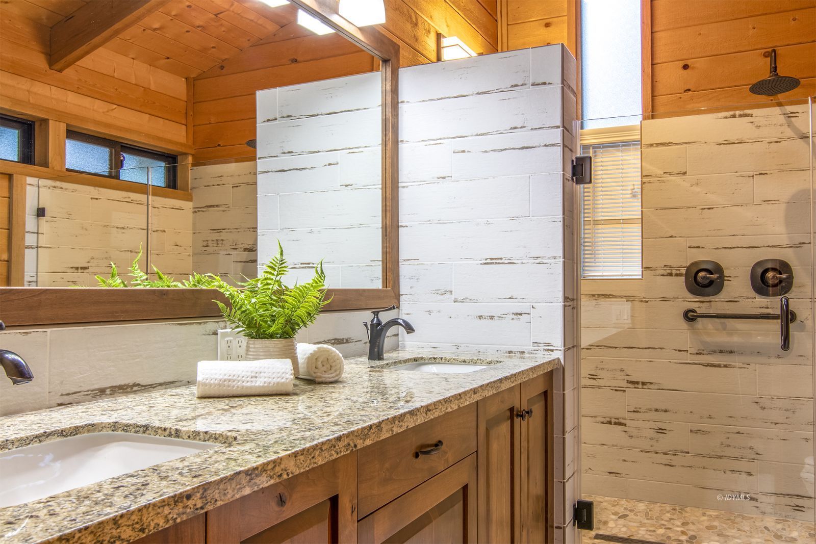 24924 Fern Valley Road Idyllwild, CA 92549 - Photo 27 of 44 a bathroom with a granite countertop sink and a mirror
