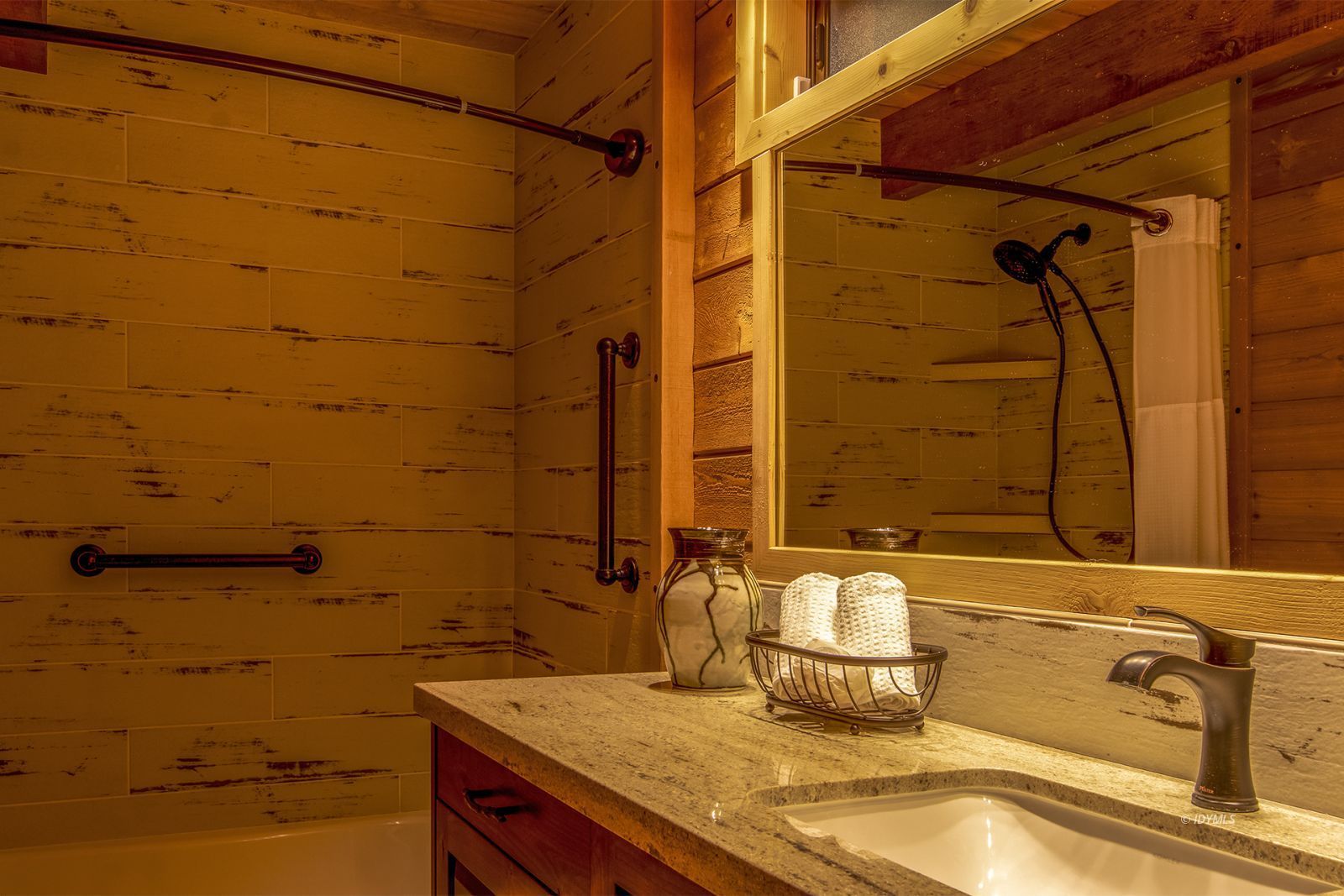 24924 Fern Valley Road Idyllwild, CA 92549 - Photo 40 of 44 a bathroom with a granite countertop sink and a mirror