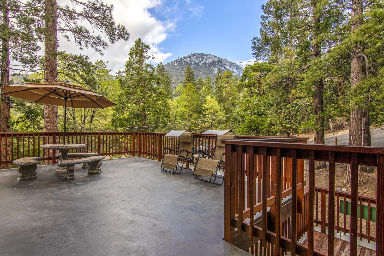 24924 Fern Valley Road Idyllwild, CA 92549 - Photo 4 of 44 a view of a chairs and table in the balcony