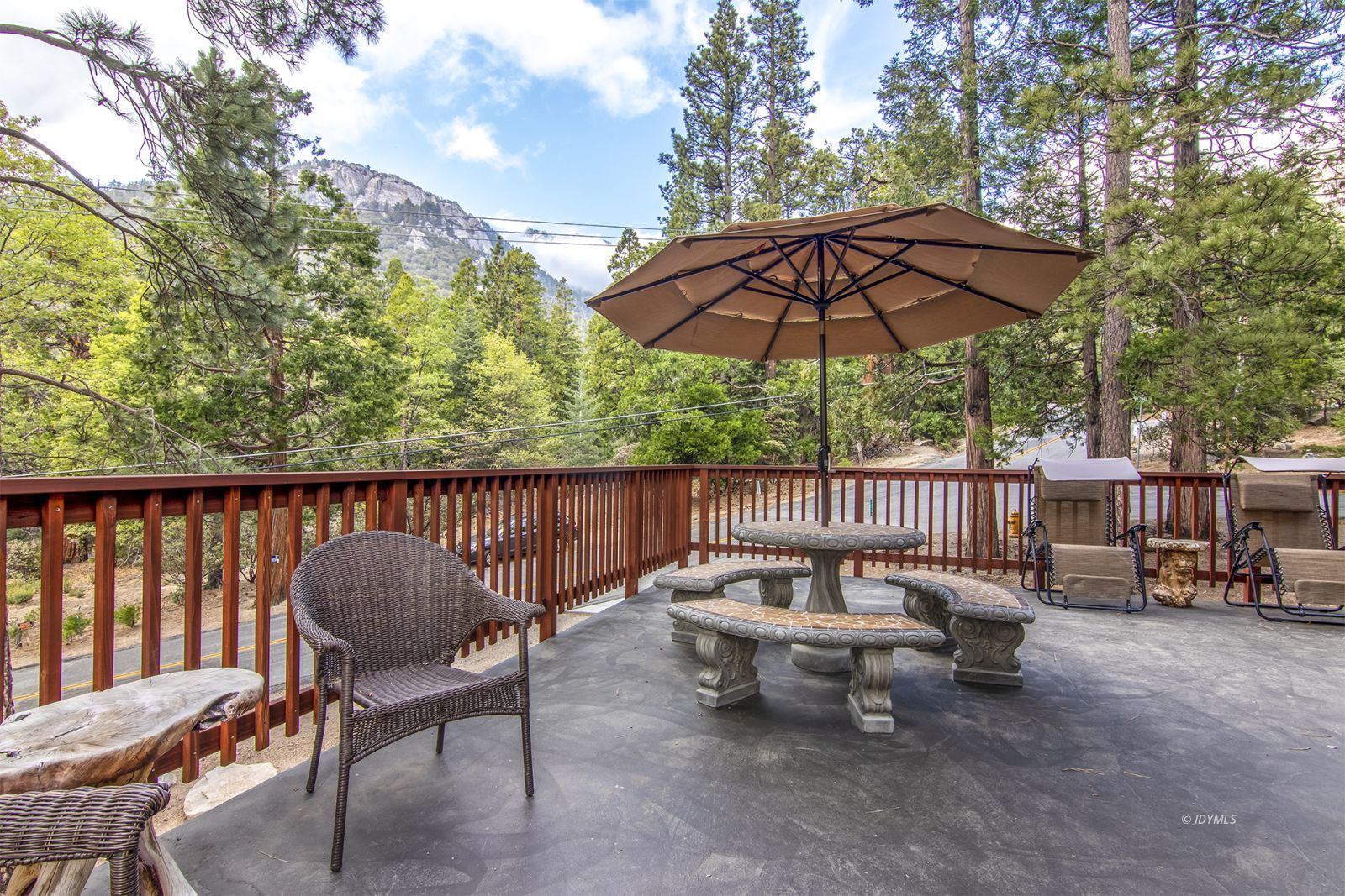 24924 Fern Valley Road Idyllwild, CA 92549 - Photo 6 of 44 a view of a chair and tables on the roof deck