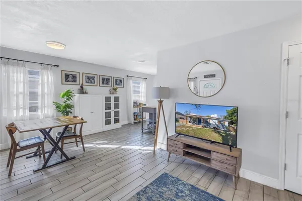 a view of room with furniture and wooden floor