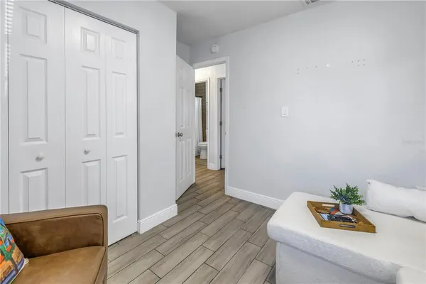 a living room with furniture and a potted plant