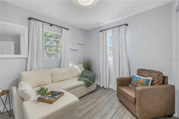 a living room with furniture and a window