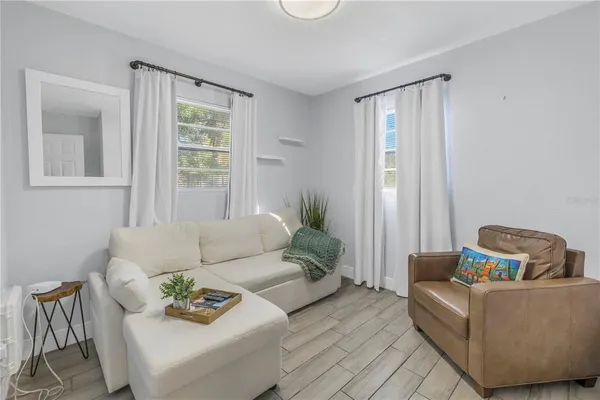 a living room with furniture and a window