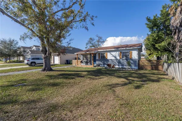 a view of house with outdoor space and sitting area