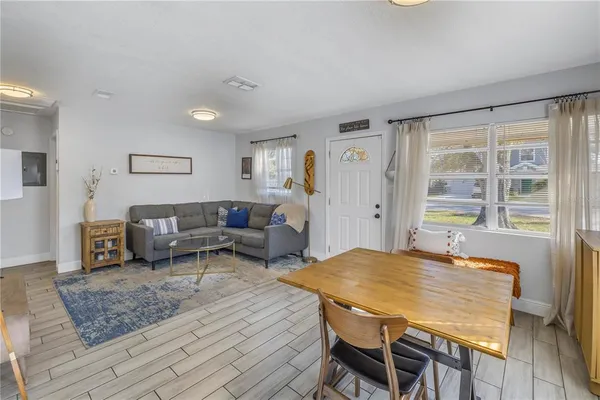 a living room with furniture and a table
