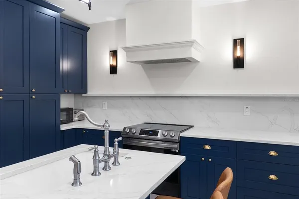 a kitchen with a sink and a stove