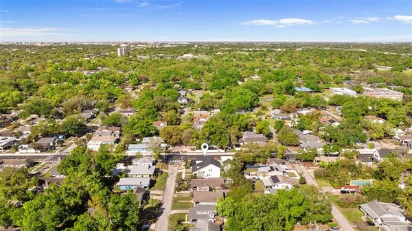 a aerial view of a house with a swimming pool