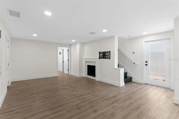a view of a livingroom with wooden floor
