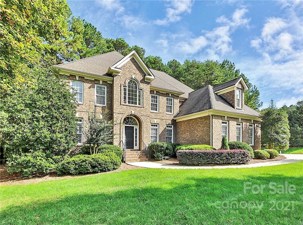 4080 Crepe Ridge Drive Denver, NC 28037 - Photo 2 of 34 a front view of a house with a yard