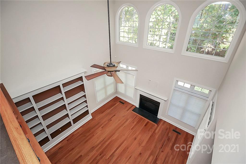 4080 Crepe Ridge Drive Denver, NC 28037 - Photo 12 of 34 wooden floor in an empty room with a window