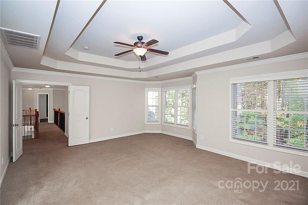 4080 Crepe Ridge Drive Denver, NC 28037 - Photo 18 of 34 a view of a livingroom with a ceiling fan and window