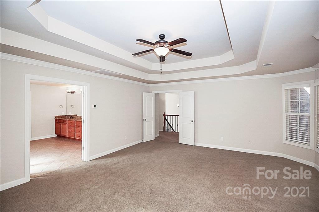 4080 Crepe Ridge Drive Denver, NC 28037 - Photo 19 of 34 a view of a livingroom with a ceiling fan and window