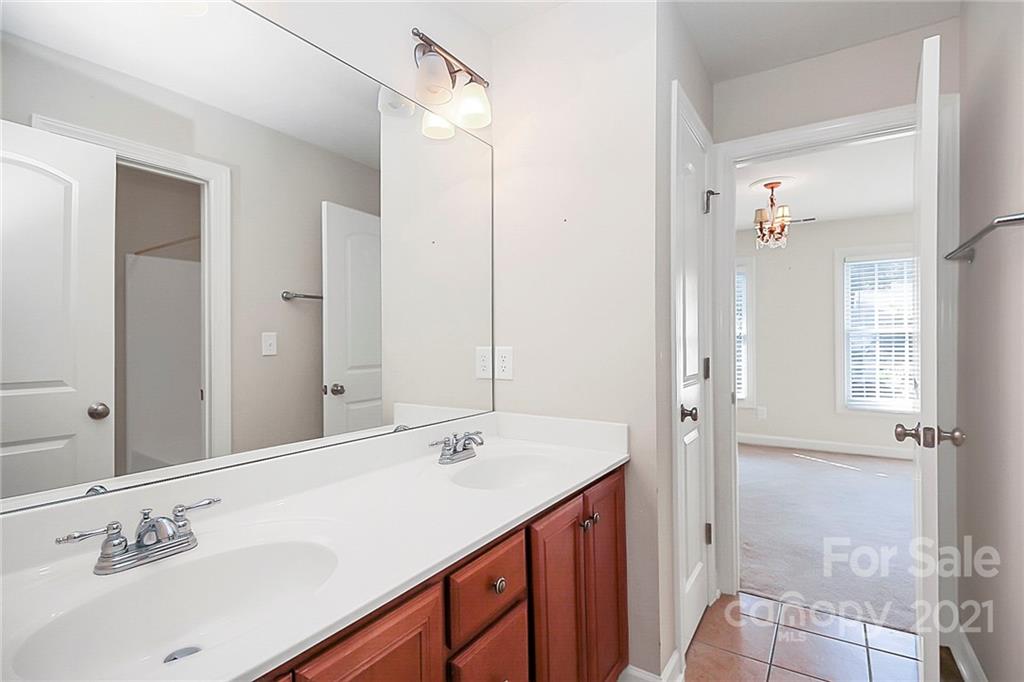 4080 Crepe Ridge Drive Denver, NC 28037 - Photo 23 of 34 a bathroom with a sink and a mirror