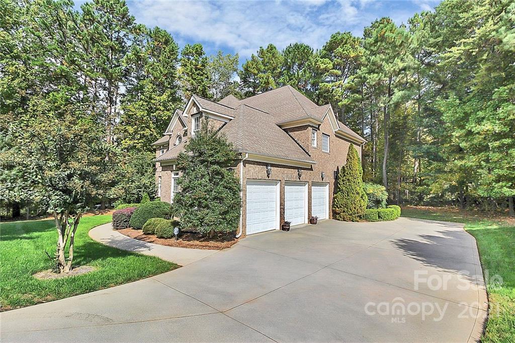 4080 Crepe Ridge Drive Denver, NC 28037 - Photo 29 of 34 a view of a house with yard and a garden