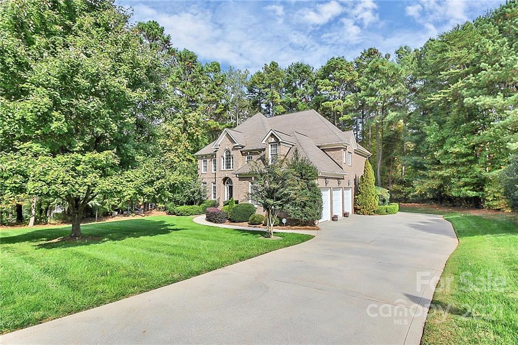 4080 Crepe Ridge Drive Denver, NC 28037 - Photo 30 of 34 a front view of a house with a yard and trees