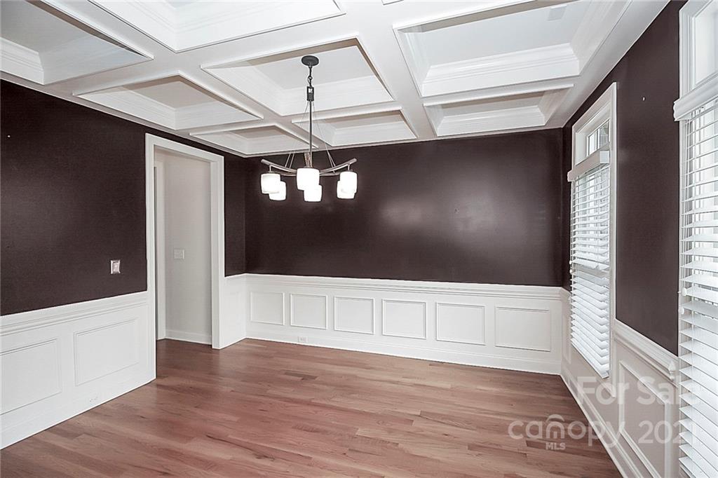 4080 Crepe Ridge Drive Denver, NC 28037 - Photo 4 of 34 a view of an empty room with wooden floor and a window