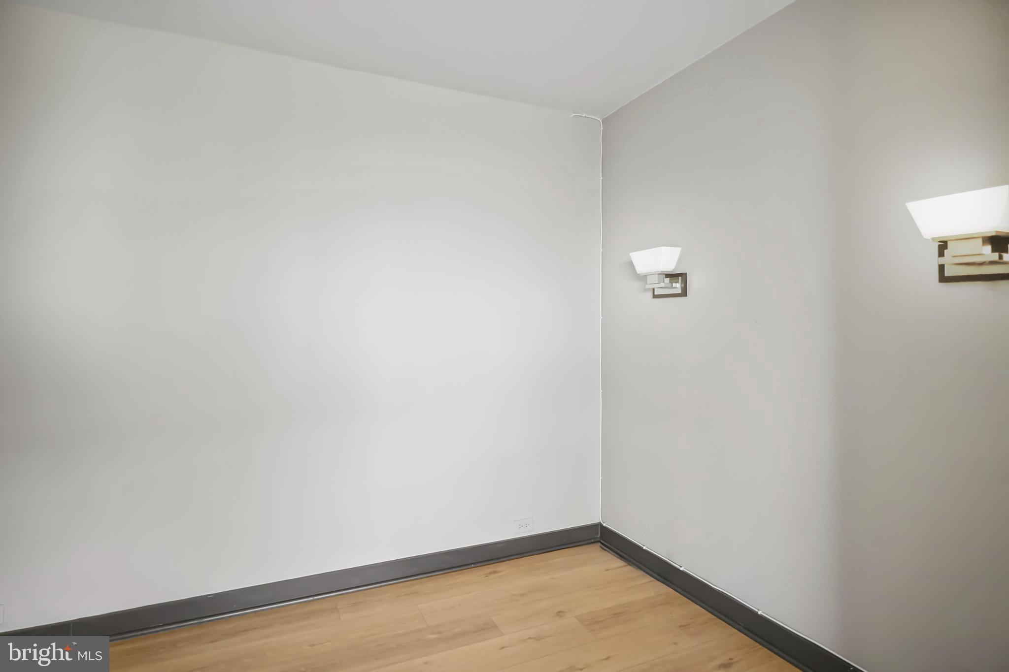 4000 North Charles Street, Unit 706 Baltimore, MD 21218 - Photo 6 of 23 a view of a small space with wooden floor