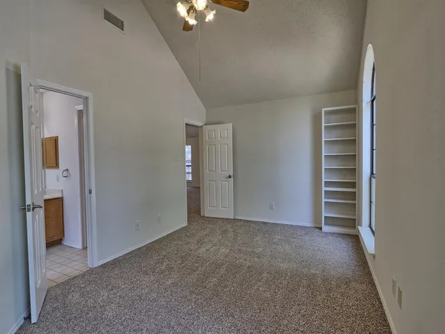 a view of an empty room with a bathroom