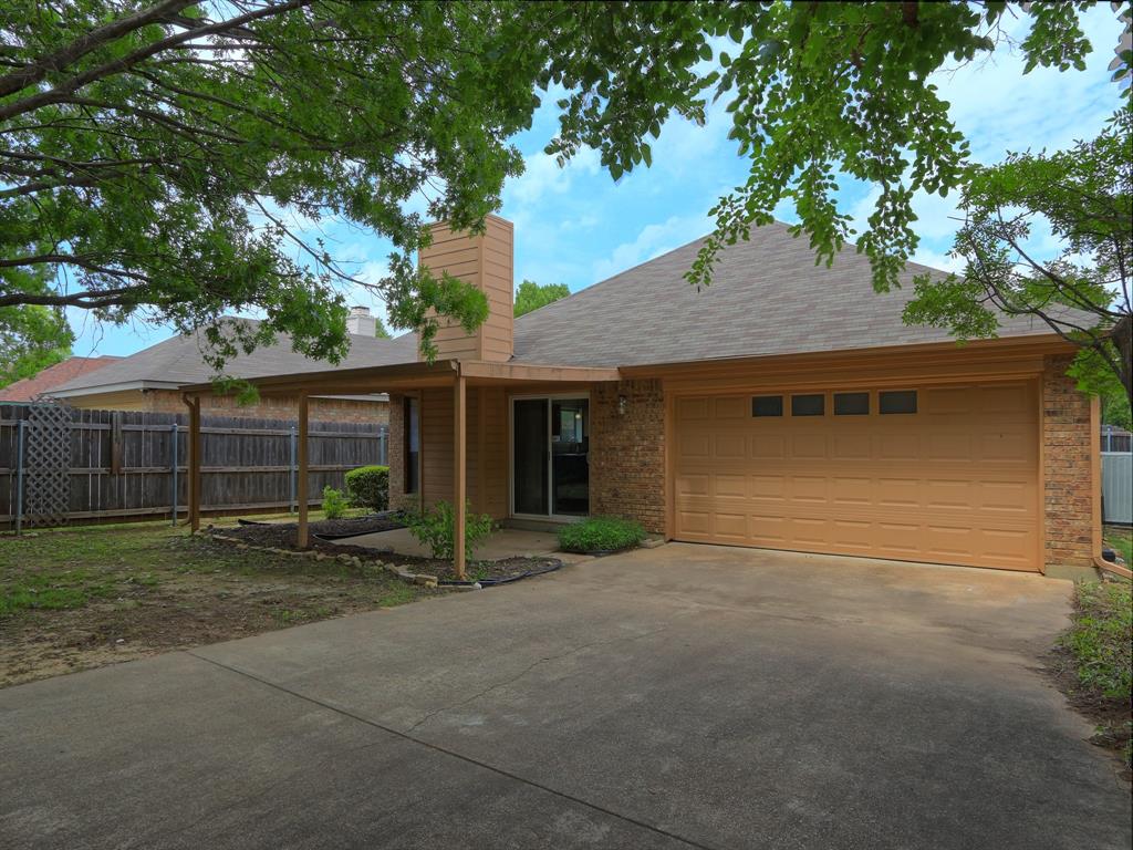 7021 Teal Drive Fort Worth, TX 76137 - Photo 4 of 24 Ranch-style house featuring brick siding, driveway, a garage, and a chimney