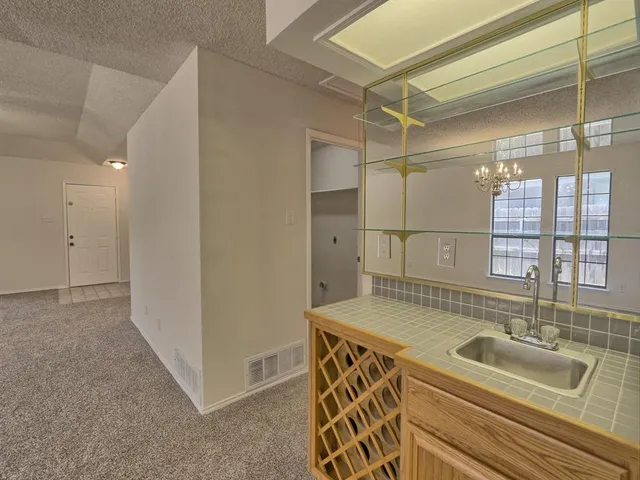 a bathroom with a tub a sink and a shower