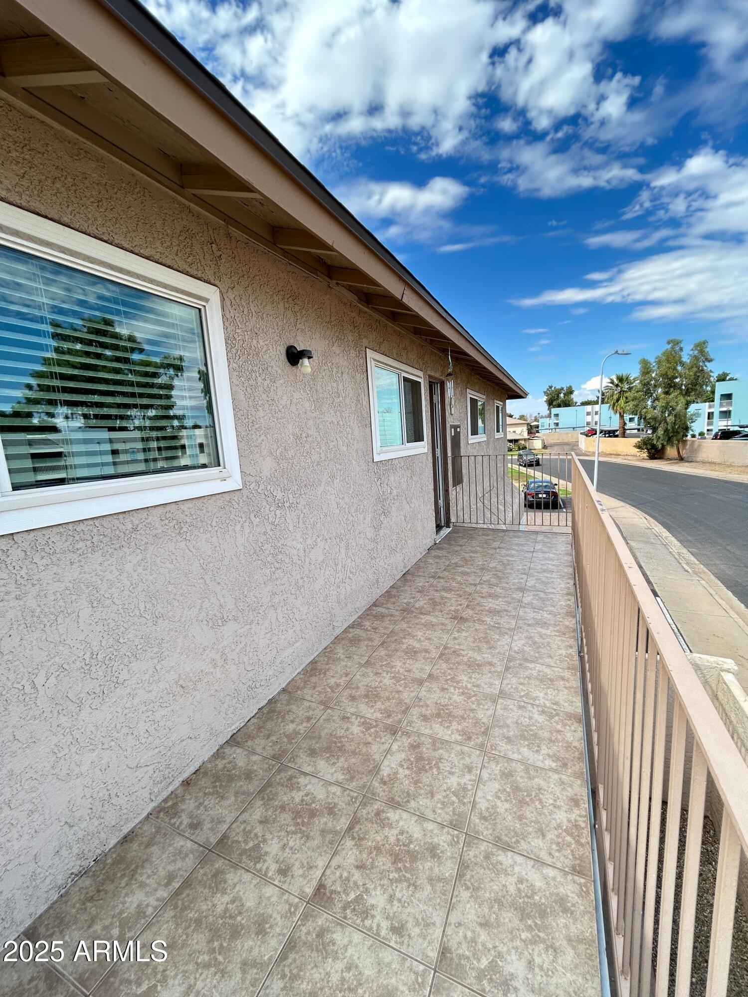 8122 North 33rd Avenue, Unit 3 Phoenix, AZ 85051 - Photo 9 of 11 a view of a house with a backyard