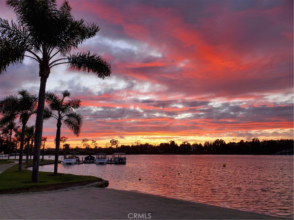 a view of lake with sunset