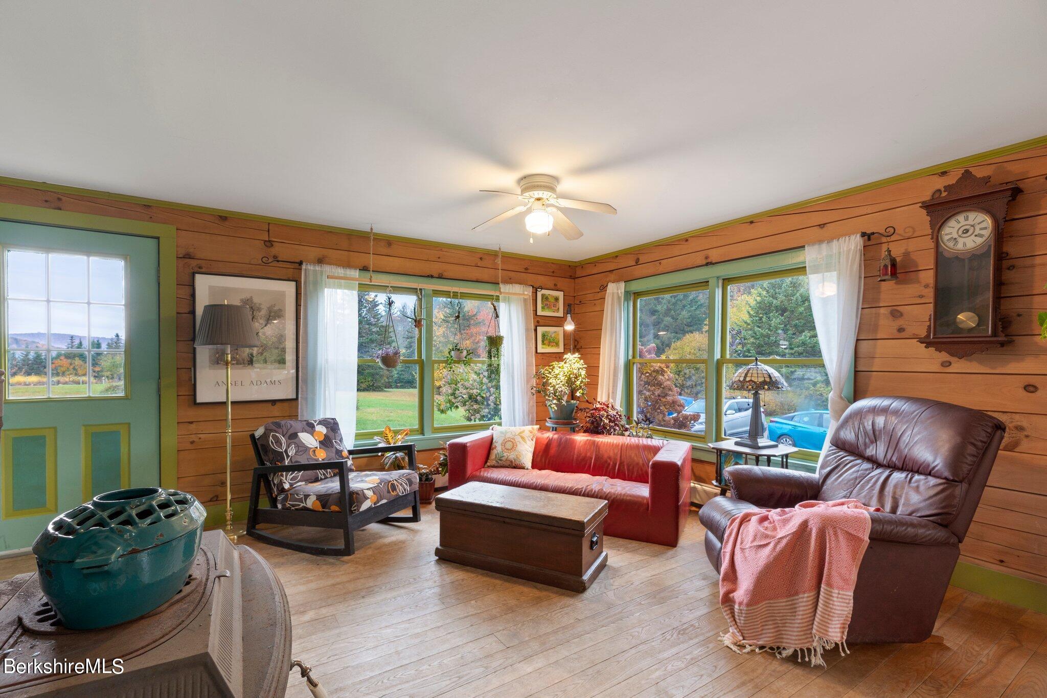 140 Windigo Road Windsor, MA 01026 - Photo 29 of 42 a bedroom with furniture and large windows