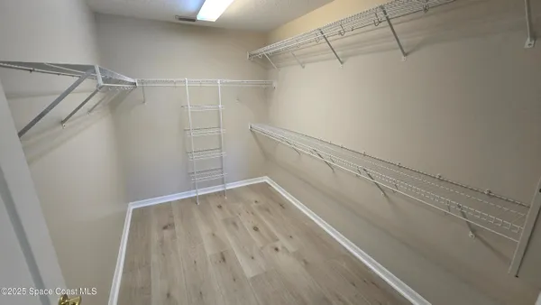 a view of a room with racks on the wall