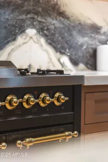a kitchen with a table and chairs in it