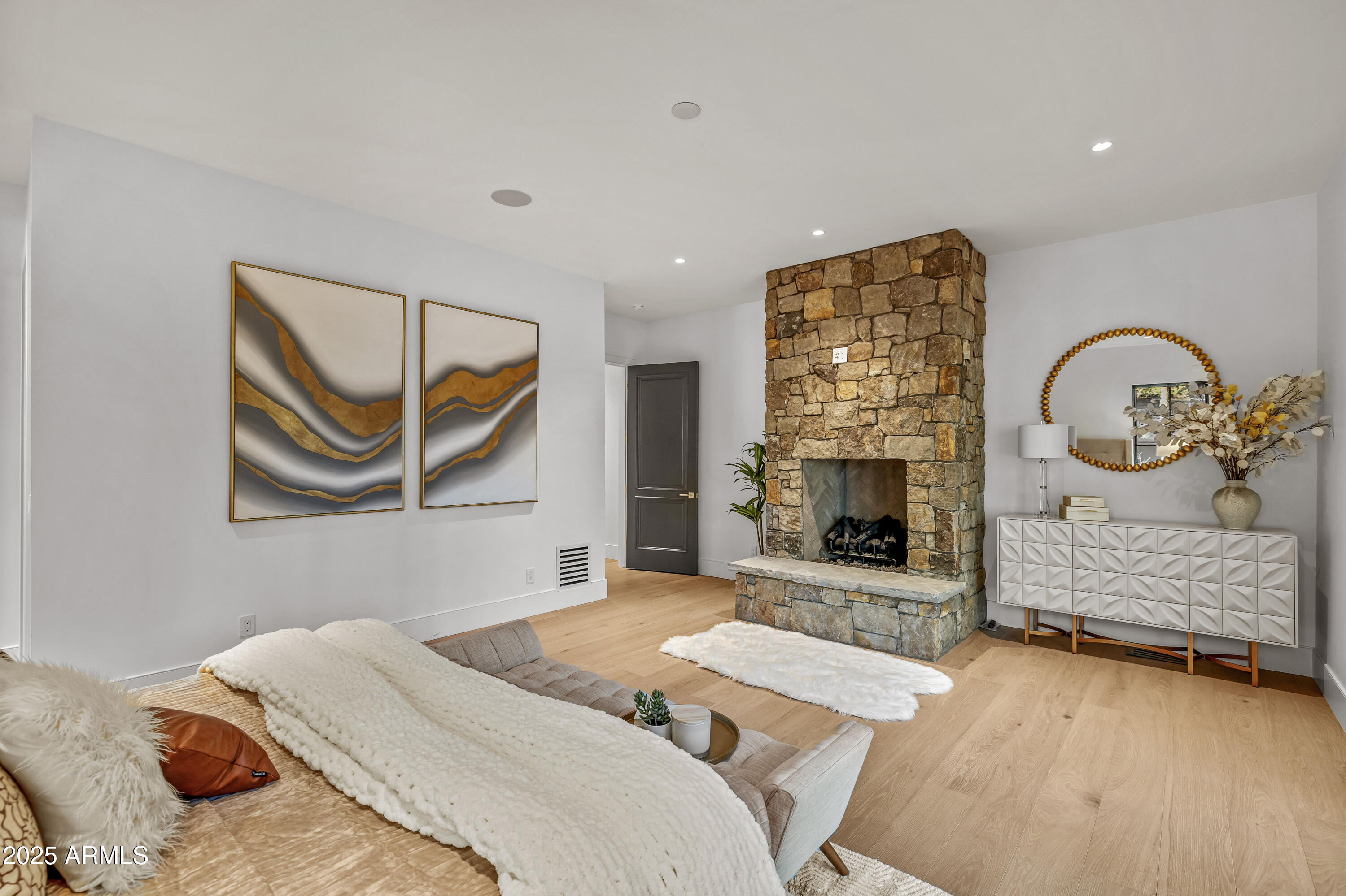 2732 Lindberg Spring Flagstaff, AZ 86005 - Photo 23 of 56 a bedroom with a bed and a fireplace