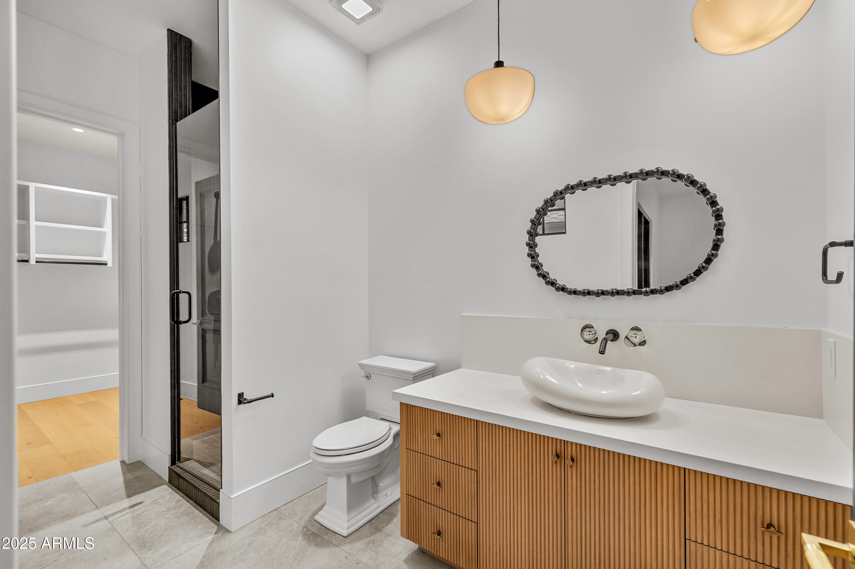 2732 Lindberg Spring Flagstaff, AZ 86005 - Photo 30 of 56 a bathroom with a toilet sink and mirror