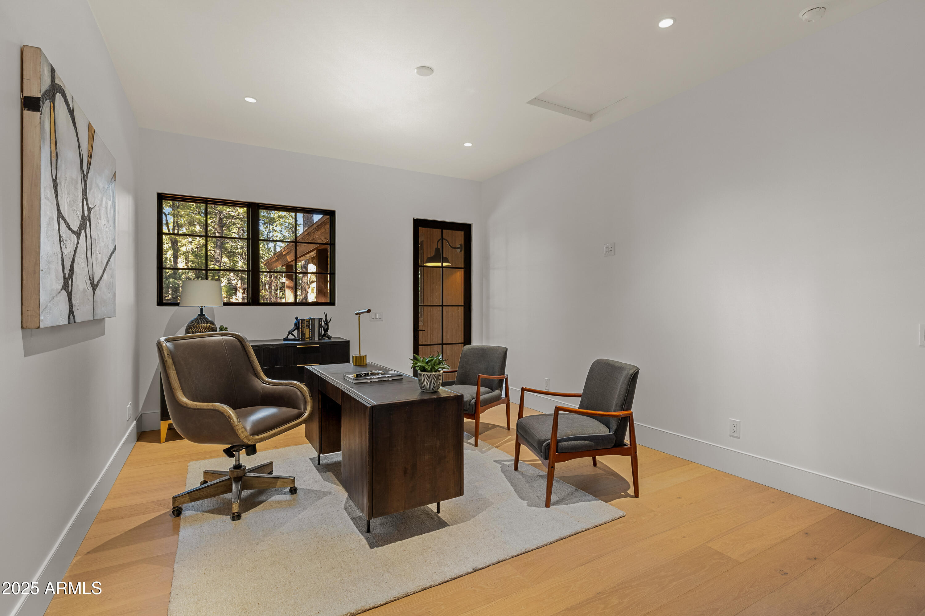 2732 Lindberg Spring Flagstaff, AZ 86005 - Photo 37 of 56 a view of a workspace with furniture and a window