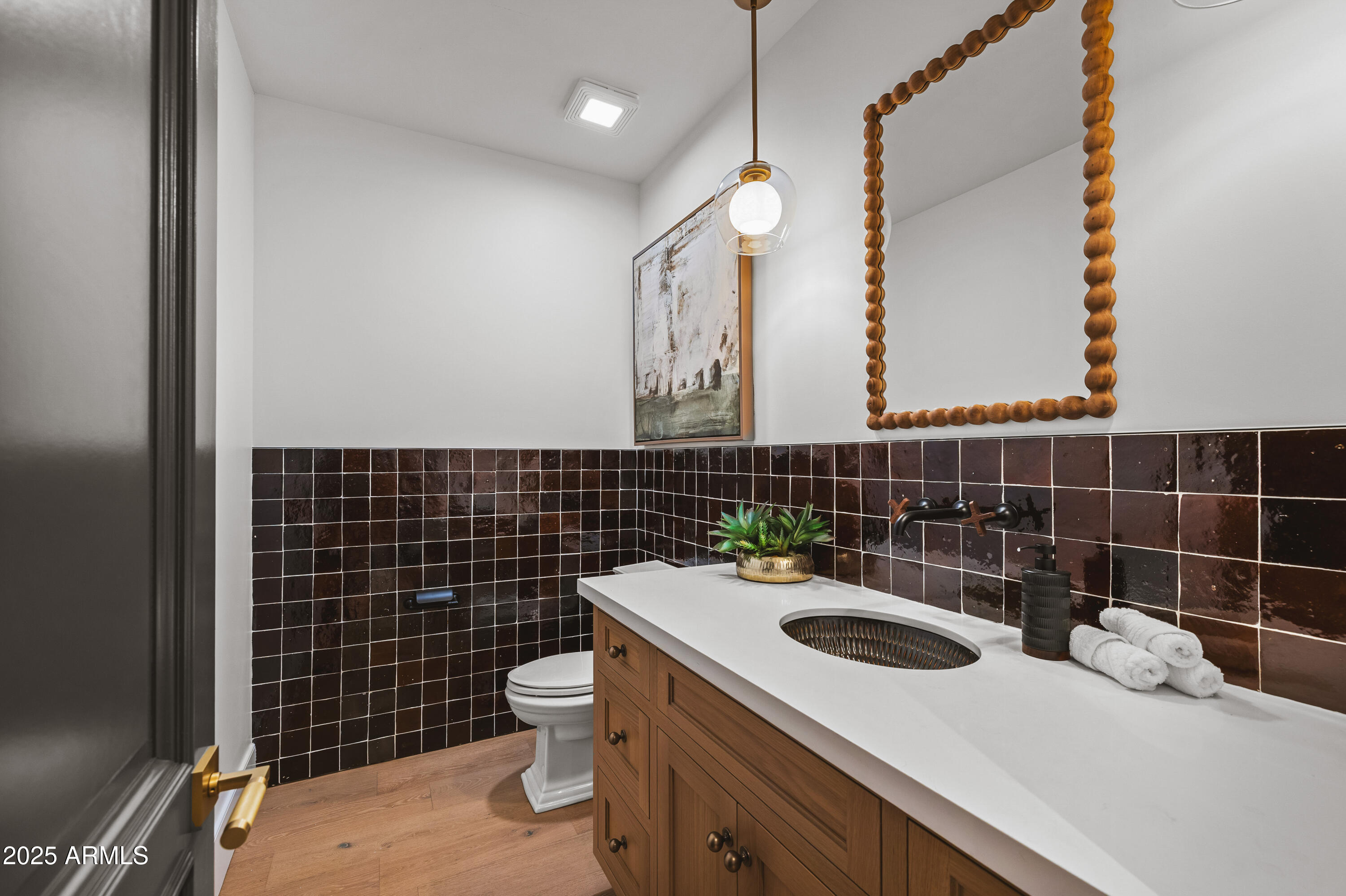 2732 Lindberg Spring Flagstaff, AZ 86005 - Photo 40 of 56 a bathroom with a sink a toilet and a mirror