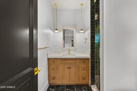 a black and white photo of a bathroom