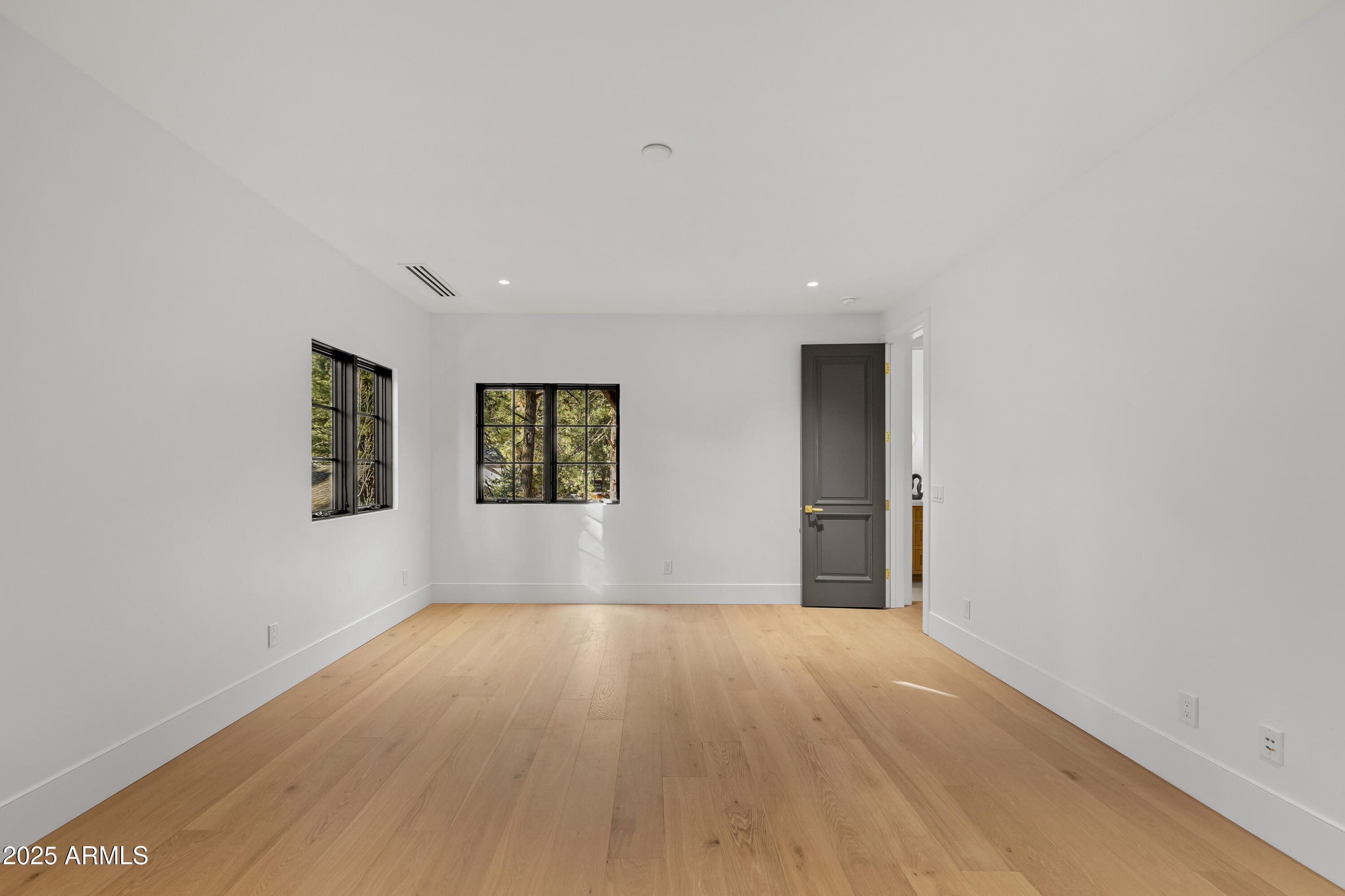 2732 Lindberg Spring Flagstaff, AZ 86005 - Photo 48 of 56 a view of an empty room with wooden floor