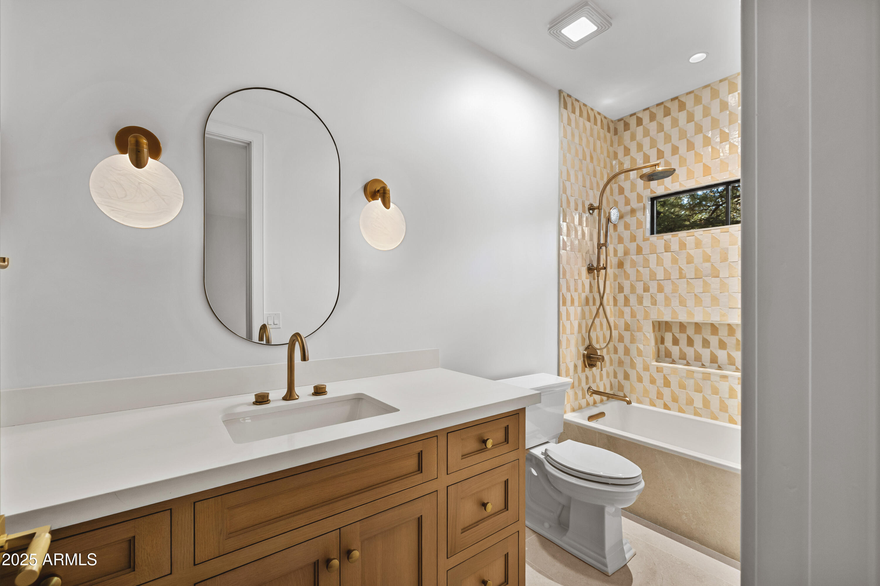 2732 Lindberg Spring Flagstaff, AZ 86005 - Photo 50 of 56 a bathroom with a toilet a sink and mirror