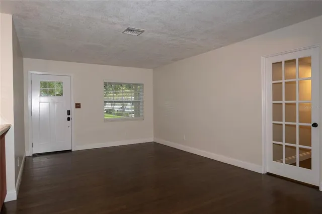 an empty room with windows