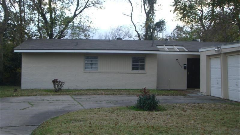 4423 Knotty Oaks Trail Houston, TX 77045 - Photo 12 of 12 a front view of a house with garden
