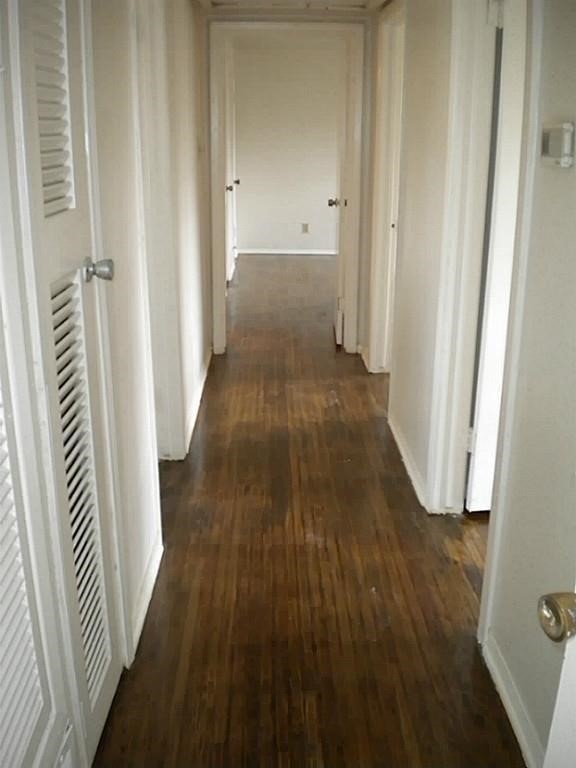 4423 Knotty Oaks Trail Houston, TX 77045 - Photo 8 of 12 a view of a hallway with wooden floor