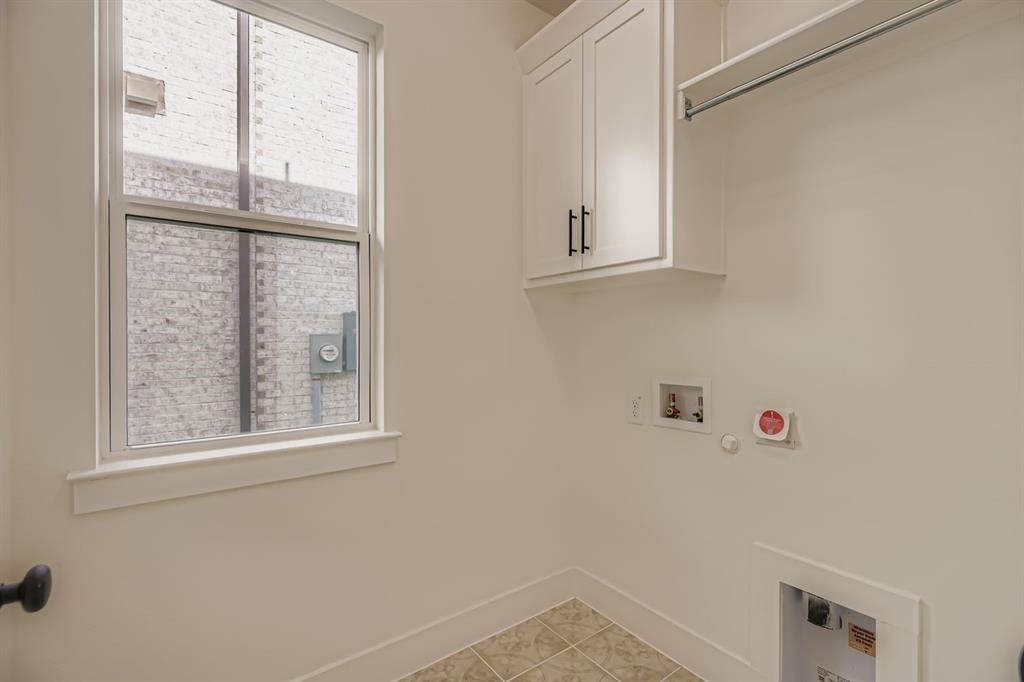 4432 Daisy Lane Prosper, TX 75078 - Photo 25 of 28 a bathroom with a window and a shower