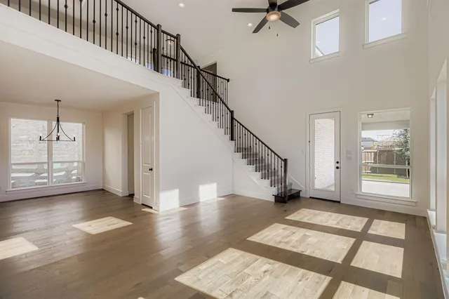 a view of entryway and hall with wooden floor