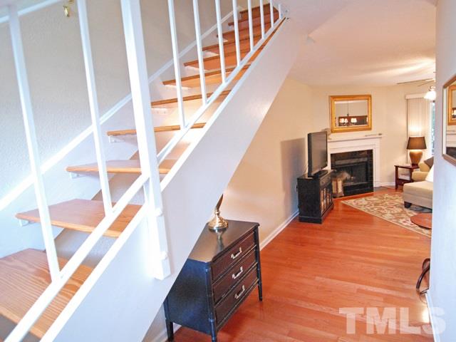 7827 Falcon Rest Circle Raleigh, NC 27615 - Photo 3 of 24 a view of living room with furniture and fireplace