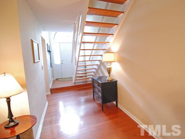 7827 Falcon Rest Circle Raleigh, NC 27615 - Photo 4 of 24 a view of room with window and wooden floor
