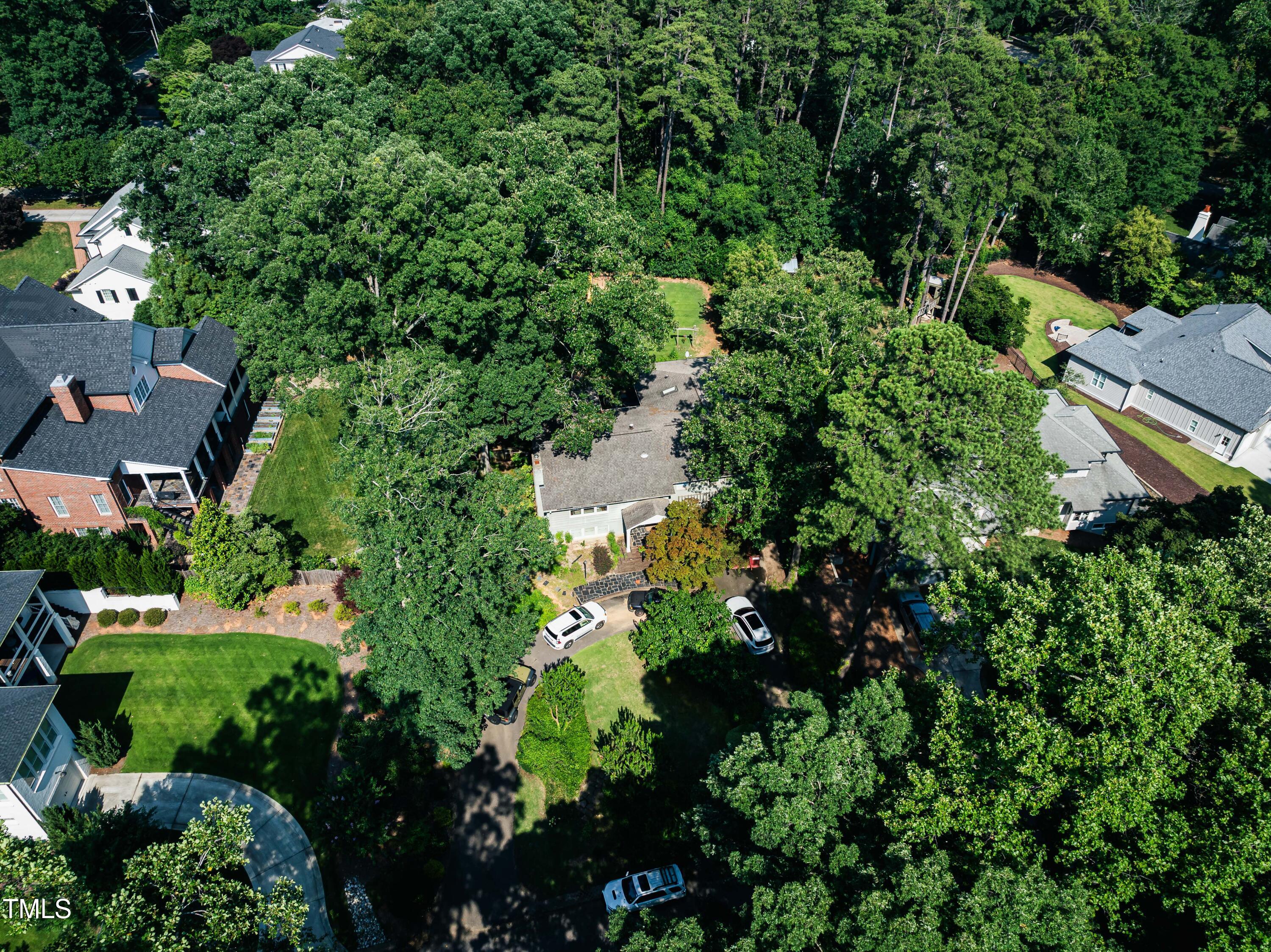 2112 St James Road Raleigh, NC 27607 - Photo 2 of 5 an aerial view of residential house with outdoor space and trees all around
