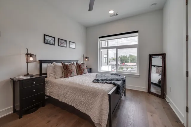 a bedroom with a bed and a window