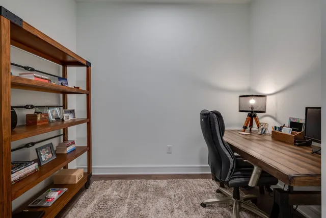 a view of a workspace with furniture