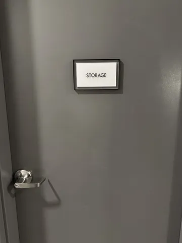 a view of walk in closet with clothes